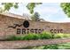 Community entrance sign for Bristol Cove with brick and greenery at 7682 S Cove Cir, Centennial, CO 80122