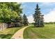 Beautiful walking path surrounded by mature trees and lush green grass near the property at 7682 S Cove Cir, Centennial, CO 80122