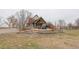 Spacious backyard with a covered patio, outdoor seating, and well-maintained lawn at 13200 E 160Th Ave, Brighton, CO 80602