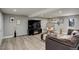 Finished basement with recessed lighting, seating, and large TV at 13200 E 160Th Ave, Brighton, CO 80602