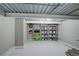 Unfinished basement with painted floor and exposed ceiling at 13200 E 160Th Ave, Brighton, CO 80602