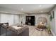 Open finished basement features a lounge chair, TV, closet, and sofa at 13200 E 160Th Ave, Brighton, CO 80602