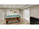 Basement featuring a pool table and adjacent bathroom at 13200 E 160Th Ave, Brighton, CO 80602