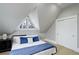 Bedroom featuring cozy decor with angled windows, carpet, and a large closet for storage at 13200 E 160Th Ave, Brighton, CO 80602