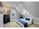 Bright bedroom with carpet, unique angled windows, and comfortable-looking bed with blue accents at 13200 E 160Th Ave, Brighton, CO 80602