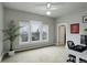 Inviting bedroom with three windows providing lots of light, ceiling fan and desk area at 13200 E 160Th Ave, Brighton, CO 80602