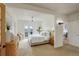 Bright primary bedroom leads to the outdoor balcony and a secondary living space at 13200 E 160Th Ave, Brighton, CO 80602
