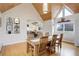 Light filled dining area with wood ceiling and open view of the kitchen at 13200 E 160Th Ave, Brighton, CO 80602