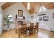 Dining room with wood beam ceiling, fireplace, and cozy window seat at 13200 E 160Th Ave, Brighton, CO 80602
