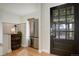 Stylish entryway boasts a modern refrigerator, decorative barrel, and attractive front door at 13200 E 160Th Ave, Brighton, CO 80602