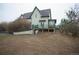 Two-story home back exterior featuring a deck at 13200 E 160Th Ave, Brighton, CO 80602