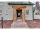 Inviting entryway features a wooden porch and stylish front door with glass panels and house number at 13200 E 160Th Ave, Brighton, CO 80602