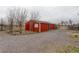 Red shed with weathered exterior and ample driveway space at 13200 E 160Th Ave, Brighton, CO 80602