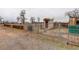 Shed surrounded by a fence on a grass and dirt lot at 13200 E 160Th Ave, Brighton, CO 80602