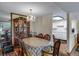 Formal dining room featuring a chandelier, china cabinet, and seating for six at 12565 Sheridan Blvd # 105, Broomfield, CO 80020