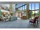 Condominium lobby with stone walls, high ceilings, and comfortable seating near large windows at 12565 Sheridan Blvd # 105, Broomfield, CO 80020