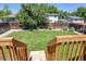 A large, green back yard is seen from the deck, ready for outdoor activities at 8463 Wheatgrass Cir, Parker, CO 80134
