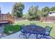 Backyard patio with outdoor furniture and a grass area perfect for entertaining at 8463 Wheatgrass Cir, Parker, CO 80134