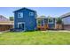 Spacious backyard featuring a patio, deck, and well-maintained lawn, enhancing outdoor living at 8463 Wheatgrass Cir, Parker, CO 80134