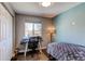 Inviting bedroom with a work space, a large window, and a calm atmosphere at 8463 Wheatgrass Cir, Parker, CO 80134