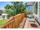 A wooden deck with a table and chairs, perfect for outdoor dining and relaxation at 8463 Wheatgrass Cir, Parker, CO 80134