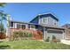 Charming home with a beautiful front yard, a wooden deck, and fresh exterior paint at 8463 Wheatgrass Cir, Parker, CO 80134