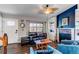 Well-decorated living room with a fireplace, stylish seating, and natural light, creating a cozy and inviting atmosphere at 8463 Wheatgrass Cir, Parker, CO 80134