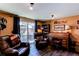Inviting living room with backyard access and roll top desk at 8463 Wheatgrass Cir, Parker, CO 80134