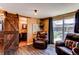 Open living room with wood floors offers backyard access and half bath at 8463 Wheatgrass Cir, Parker, CO 80134