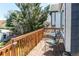 Outdoor wood deck featuring chairs, a table, and natural light at 8463 Wheatgrass Cir, Parker, CO 80134