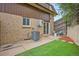 Cozy backyard patio area with well maintained lawn and easy access from inside the property at 5573 S Lowell Blvd, Littleton, CO 80123