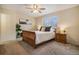 Inviting bedroom with a ceiling fan, soft carpeting, and natural light from the window at 5573 S Lowell Blvd, Littleton, CO 80123