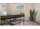 Bright bedroom with two windows and neutral carpeting, perfect for a home office or guest room at 5573 S Lowell Blvd, Littleton, CO 80123