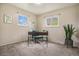Bright bedroom with two windows and neutral carpeting, perfect for a home office or guest room at 5573 S Lowell Blvd, Littleton, CO 80123