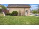 Lovely home with green lawn and mature landscaping, creating a welcoming outdoor space at 5573 S Lowell Blvd, Littleton, CO 80123