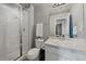 Bathroom featuring shower with glass enclosure, a vanity with modern fixture, and updated finishes at 8695 Torrey St, Arvada, CO 80007