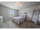 Bedroom featuring a bed with storage underneath, carpet flooring, and neutral paint at 8695 Torrey St, Arvada, CO 80007