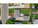 Aerial view of a house with a detached garage and a well-maintained lawn, in a quiet residential neighborhood at 2542 S Winona Ct, Denver, CO 80219