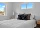 Bright bedroom with natural light, modern decor, and comfortable furnishings at 2542 S Winona Ct, Denver, CO 80219