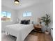 Inviting bedroom with lots of natural light, neutral color scheme, and wood-look floors at 2542 S Winona Ct, Denver, CO 80219