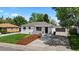 Charming single-story home with fresh landscaping, newly painted exterior and detached garage in the back at 2542 S Winona Ct, Denver, CO 80219