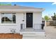 This home's exterior is newly painted and features an updated front entry and a well maintained yard at 2542 S Winona Ct, Denver, CO 80219
