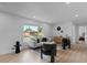 Inviting living room with large window, modern furniture, and wood-look floors at 2542 S Winona Ct, Denver, CO 80219