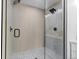 Modern glass-enclosed shower showcases stylish tile, a rainfall showerhead, and sleek hardware at 2542 S Winona Ct, Denver, CO 80219