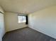 Inviting bedroom with neutral carpet, a window with a curtain and natural light at 12470 E Cornell Ave # 203, Aurora, CO 80014