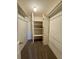 Spacious walk-in closet features built-in shelving and ample storage for an organized wardrobe at 12470 E Cornell Ave # 203, Aurora, CO 80014