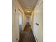 Hallway features neutral carpet and provides seamless access to bedrooms in the house at 12470 E Cornell Ave # 203, Aurora, CO 80014