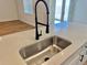 Modern kitchen sink with a pull-down faucet at 42978 Colonial Trl, Elizabeth, CO 80107