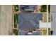 Aerial view of a home showing the roof and surrounding landscaping at 19409 W 88Th Dr, Arvada, CO 80007