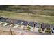 Aerial view capturing a block of modern houses in a suburban neighborhood with scenic views at 19409 W 88Th Dr, Arvada, CO 80007